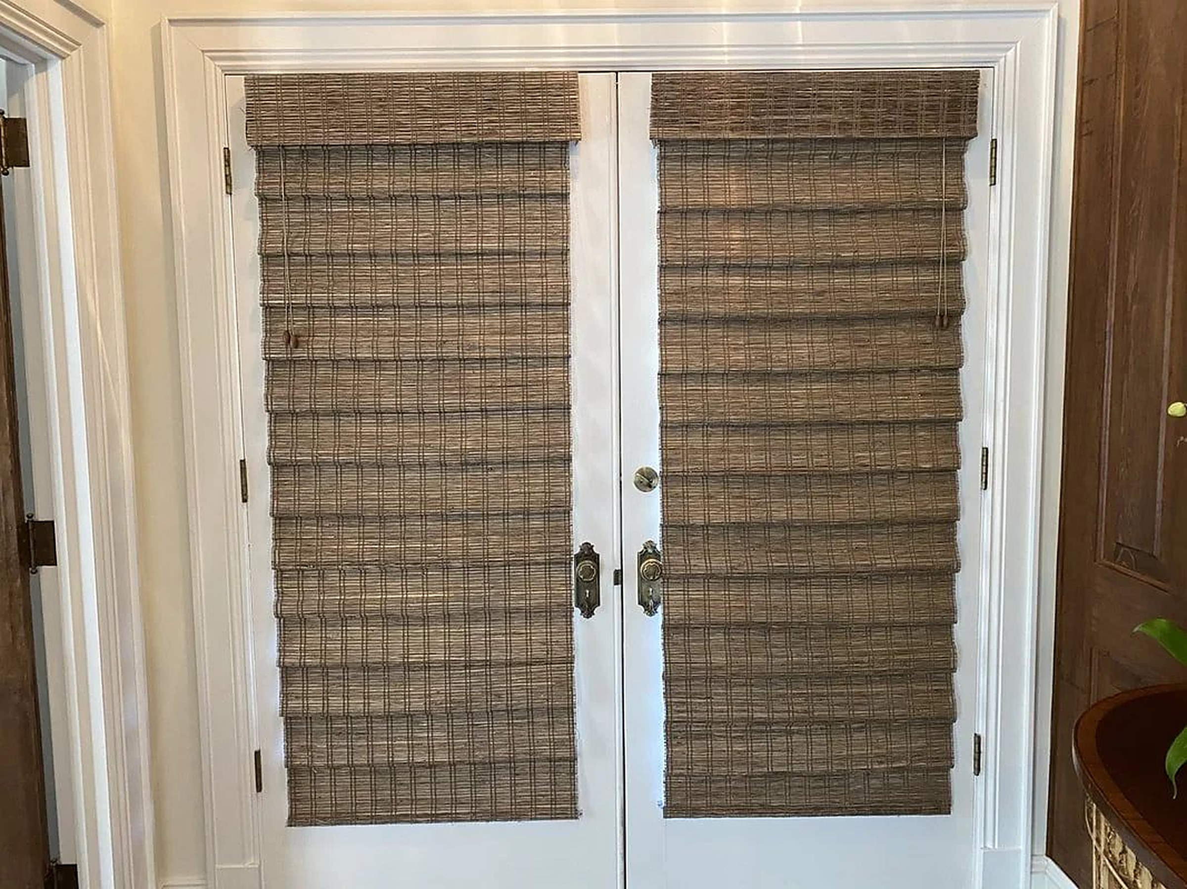 French doors fitted with woven grass shades