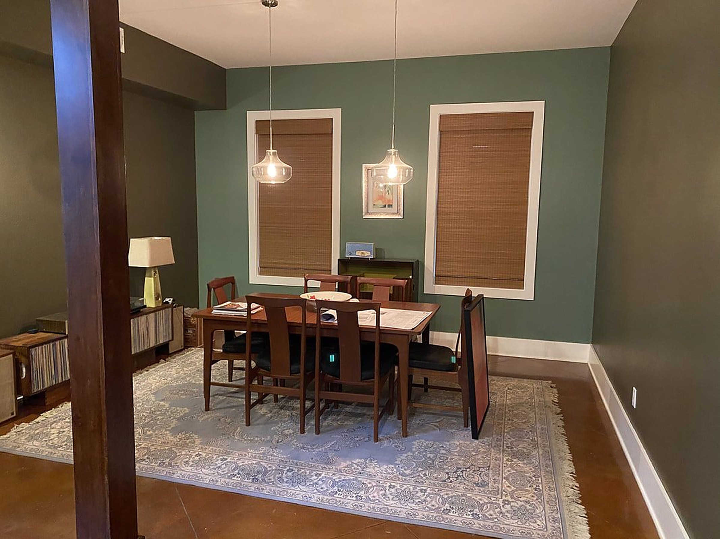 Windows with cellular honeycomb shades partially lowered
