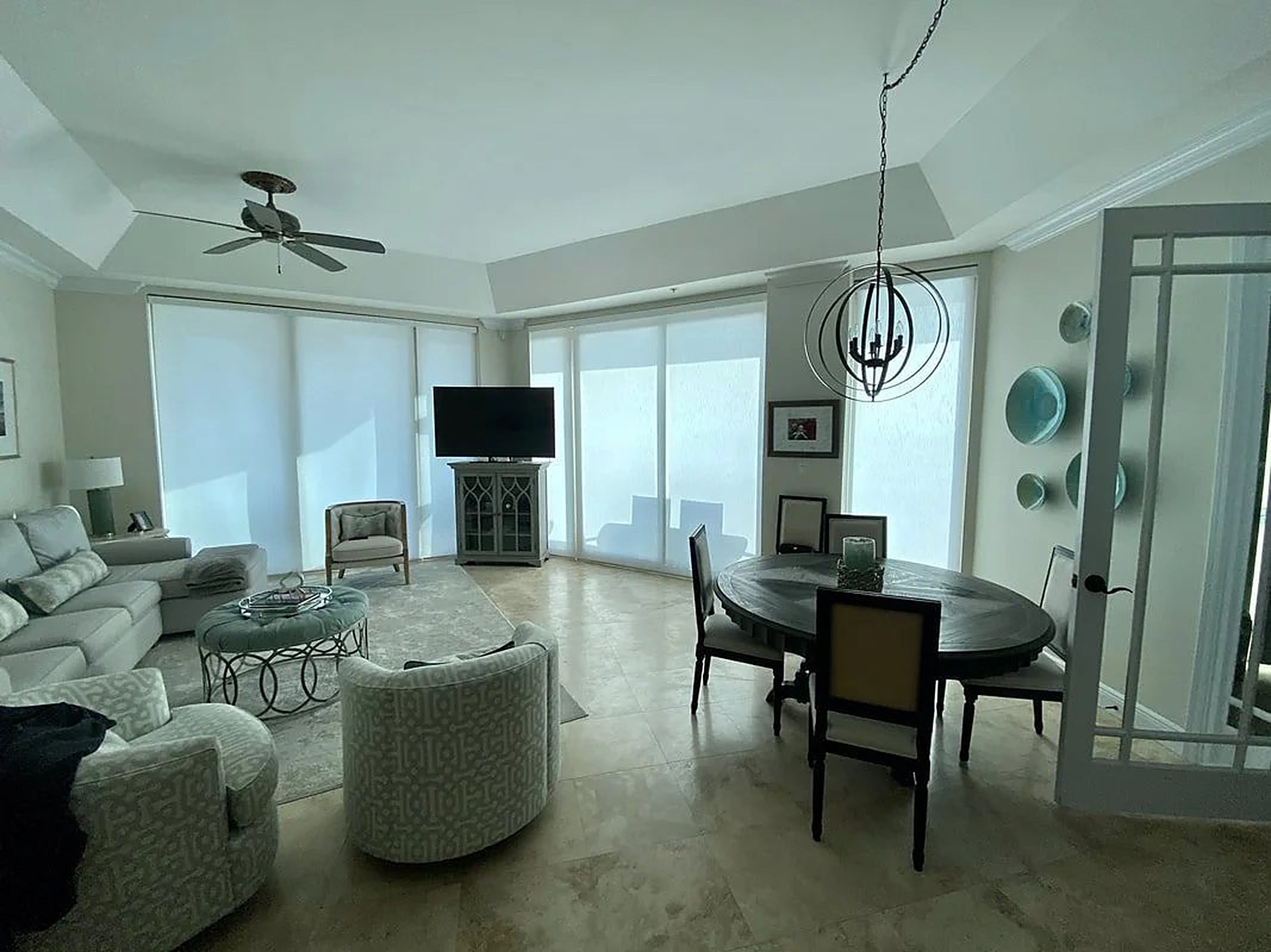 Coastal great room with energy-efficient shades on every window